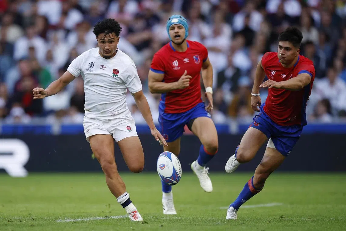 England's Marcus Smith (left) runs to score a try during the match against Chile.