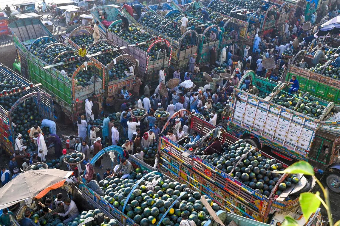 Farmers selling watermelons at the fruit market in Lahore, Pakistan, on May 15, 2024.