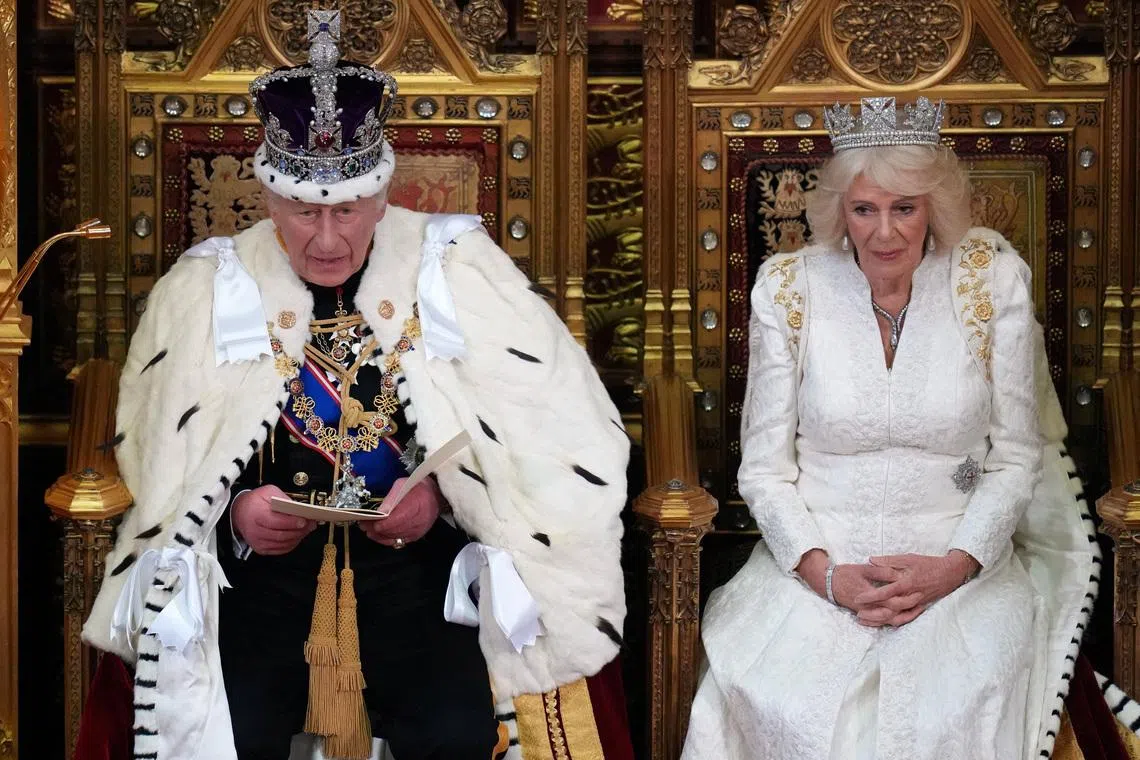 Britain's King Charles III speaks as he sits besides Queen Camilla during the State Opening of Parliament at the Palace of Westminster in London, Wednesday, May 13, 2026.    Kirsty Wigglesworth/Pool via REUTERS