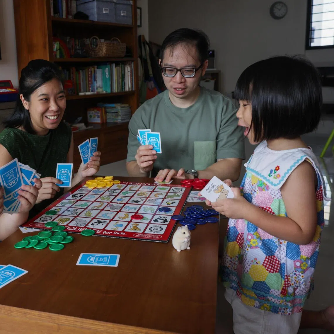 Church worker Jerrold Hong and his wife, teacher Rachel Lim, both 36, often play board games with their children, Zechariah and Esther, to cultivate play as a way of bonding with their children. 