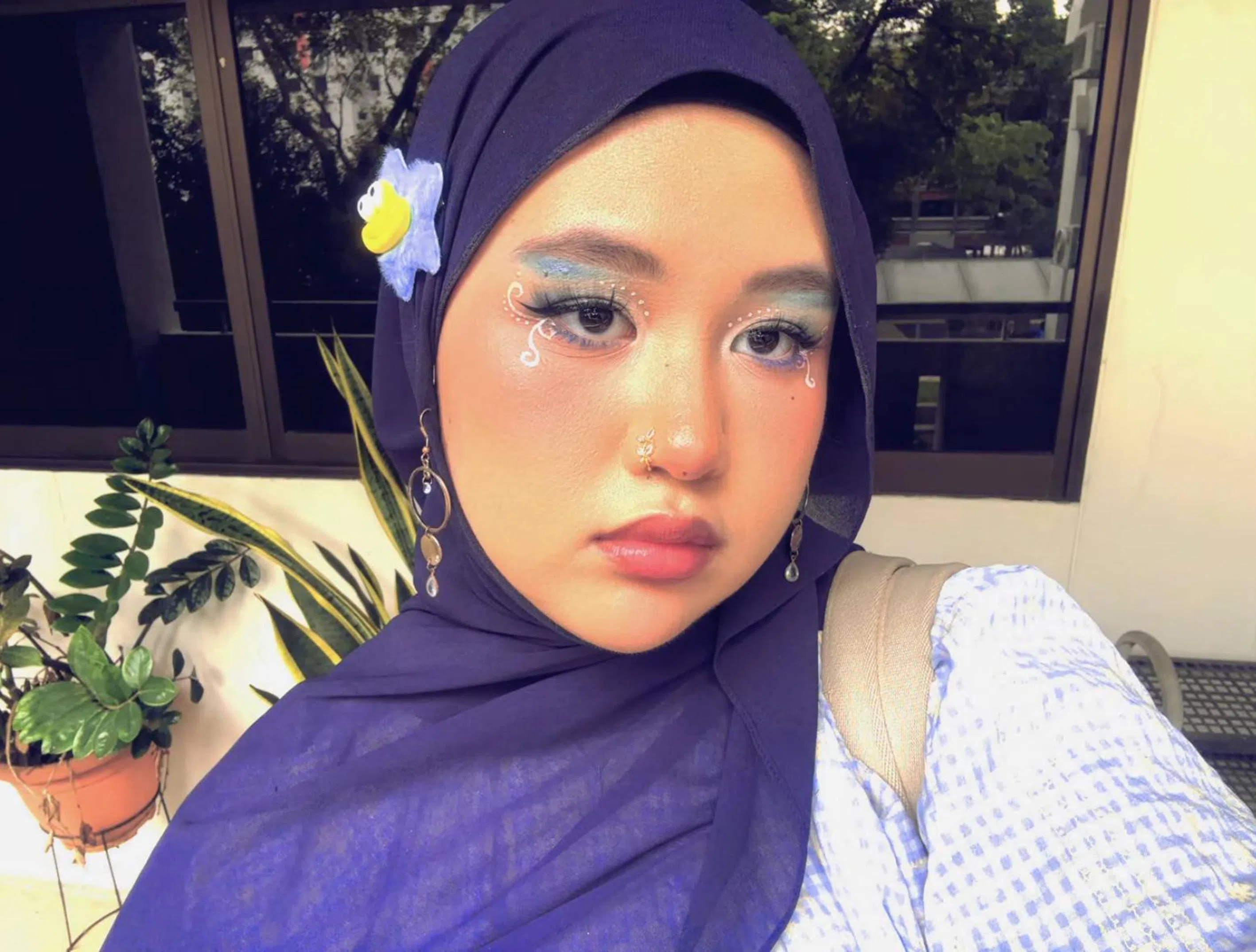 Student Hadhirah Insyirah Binte Alfie Fadzil adds whimsy to her make-up looks.