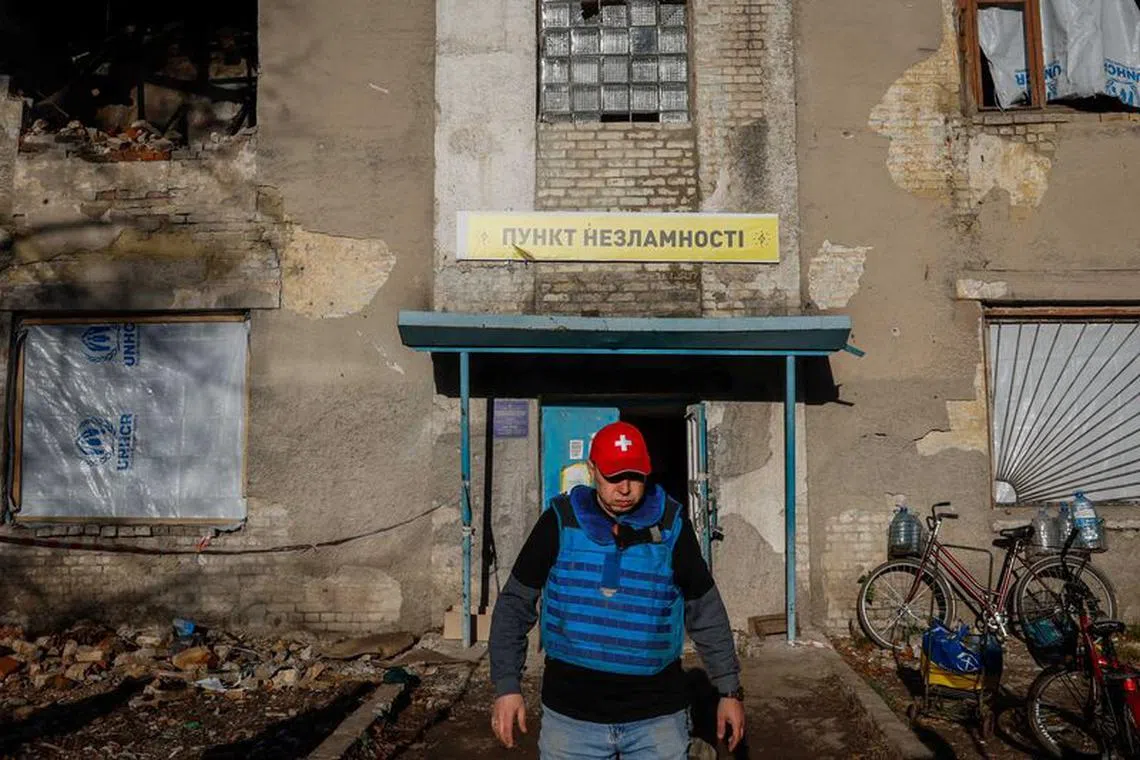Yevhen Tkachov, 54 year-old, volunteer and local citizen, walks in front of an invincibility point, amid Russia's attack on Ukraine, in the town of Chasiv Yar, Donetsk region, Ukraine November 8, 2023. REUTERS/Alina Smutko