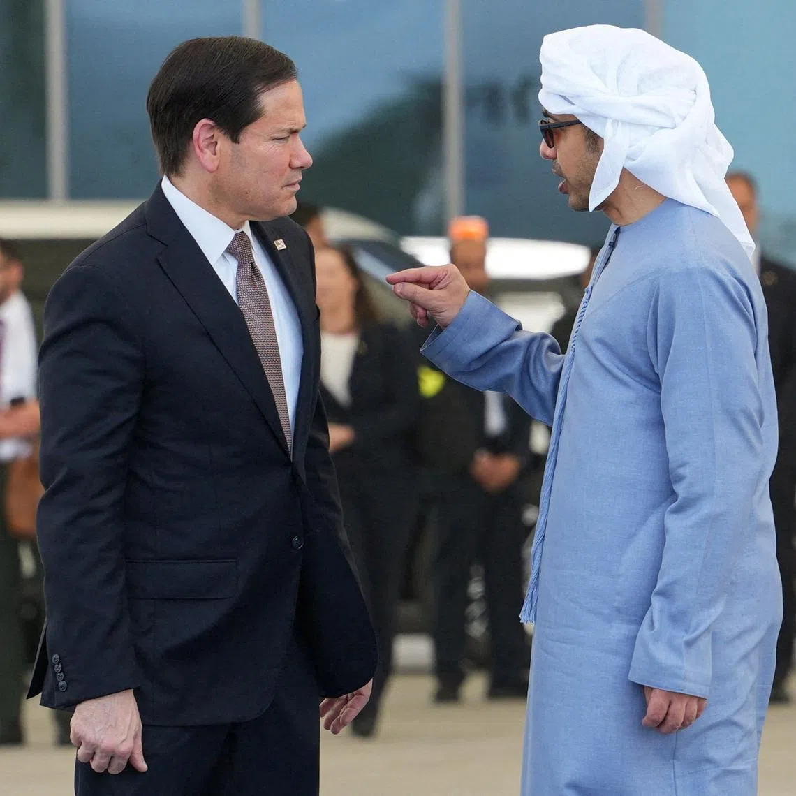 U.S. Secretary of State Marco Rubio talks to the United Arab Emirates' Foreign Minister Sheikh Abdullah bin Zayed bin Sultan Al Nahyan before boarding a U.S. Air Force C-17 Globemaster III transport aircraft at Al Bateen Executive Airport, en route to Kuwait during his visit to the Middle East to discuss the interim deal between the U.S. and Iran with Arab Gulf allies, in Abu Dhabi, United Arab Emirates, June 24, 2026. REUTERS/Eric Lee/Pool