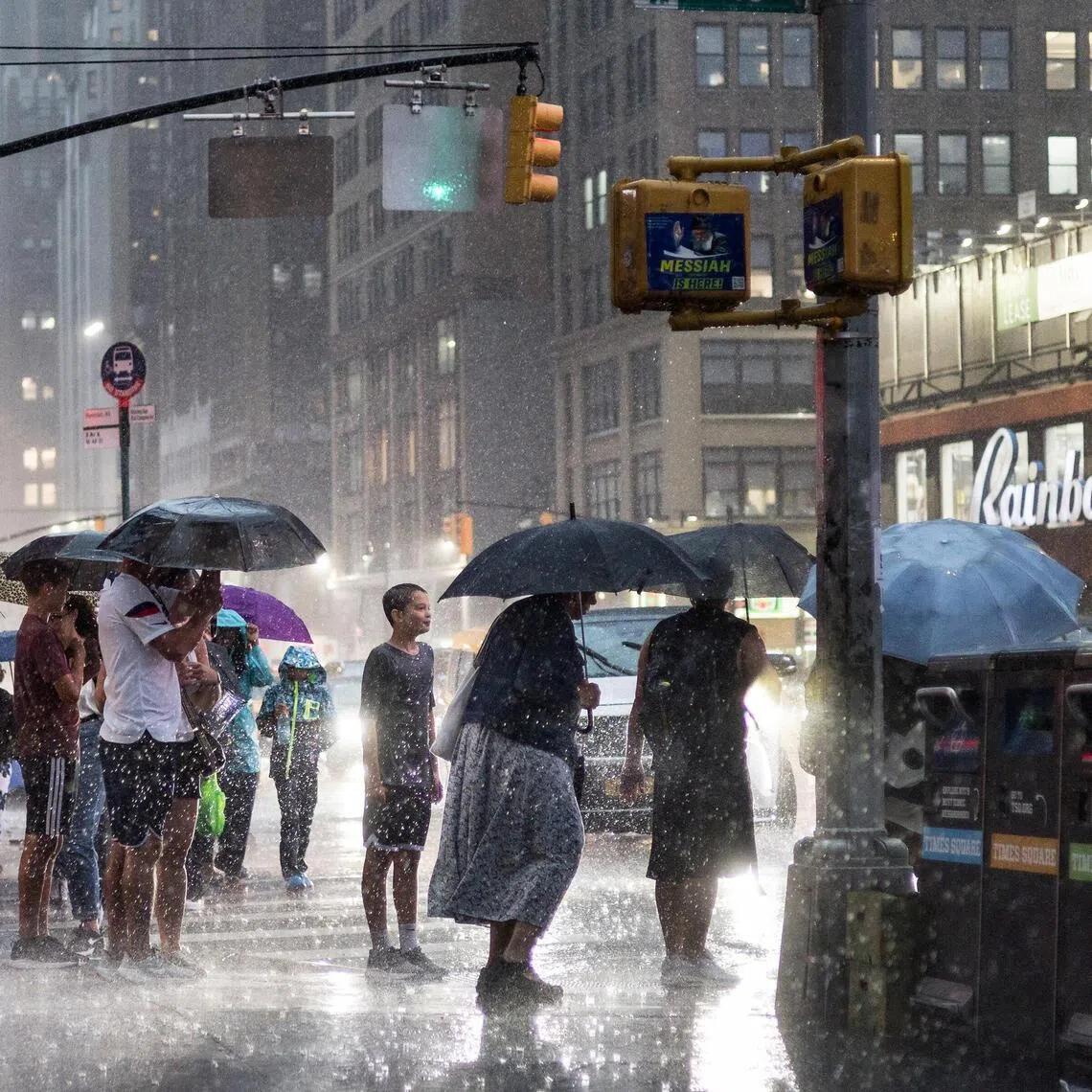 People caught in a rain storm in New York in August 2026. The risk of extreme weather increases under El Nino conditions.