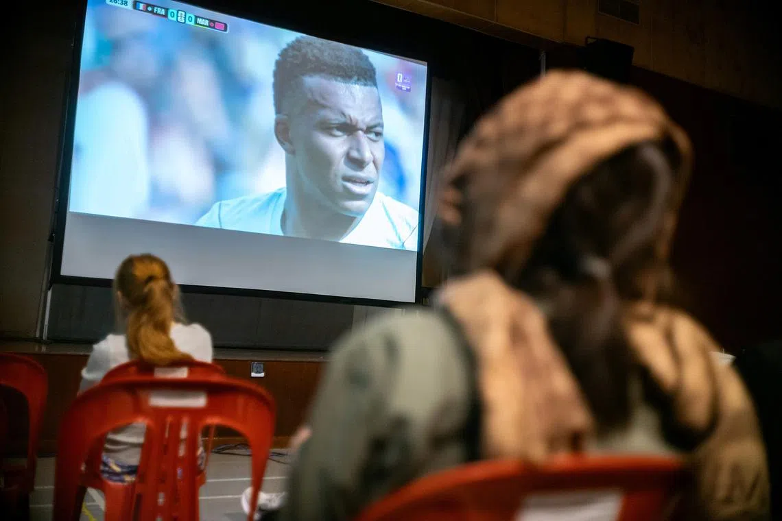 Fans watching the FIFA World Cup 2026 quaterfinals match between France and Morocco at Bukit Timah Community Club in the wee hours of the morning on July 10, 2026. ST PHOTO: BRIAN TEO