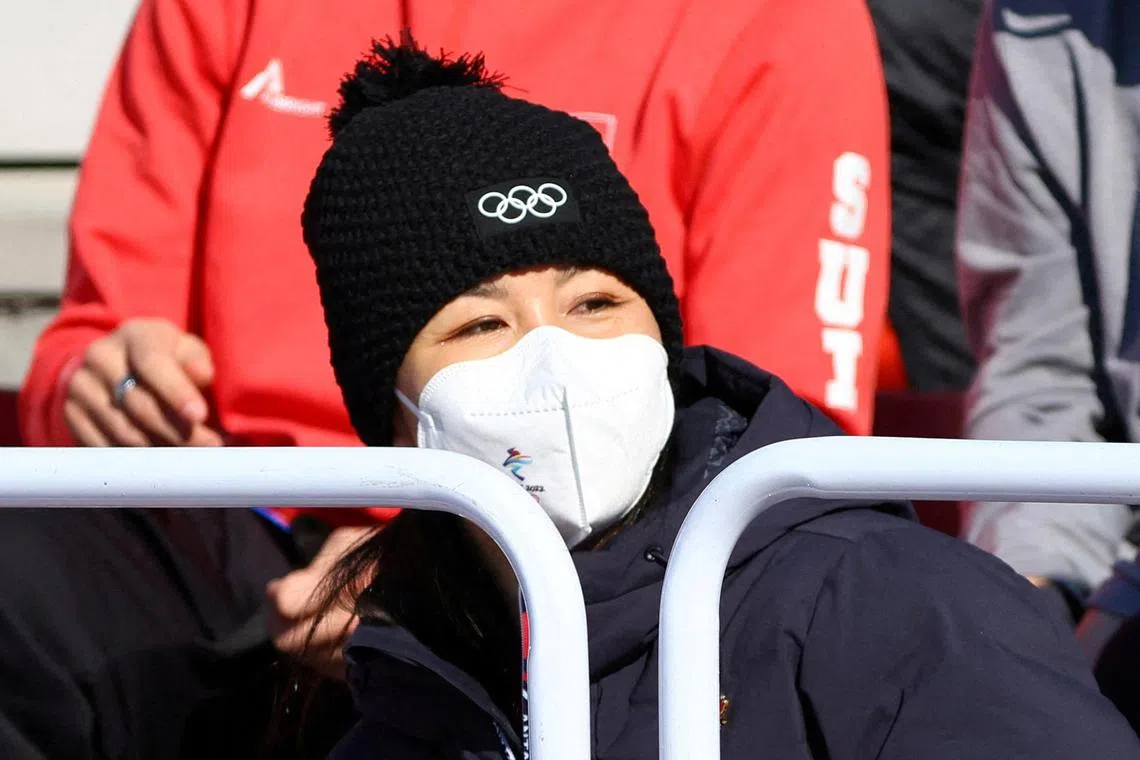 China's Peng Shuai, wearing a face mask, watches freestyle skiing during the 2022 Winter Games in Shougang, Beijing, in February 2022. The WTA will resume operations in China this year, it said on Thursday, citing the “extraordinary price” on players as reason for reversing a decision taken over concerns for the safety of former doubles No. 1 Peng.