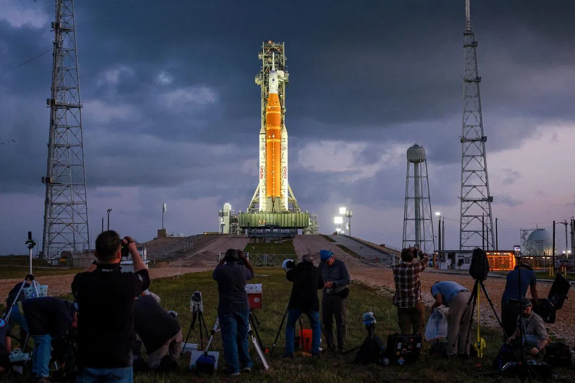 Enthusiasts setting up cameras to photograph NASA's Artemis II lunar flyby mission, with the next-generation moon rocket, the Space Launch System (SLS) rocket and the Orion crew capsule, on Pad 39B ahead of the launch of the Artemis II mission at the Kennedy Space Center in Cape Canaveral, Florida, U.S. on March 31, 2026.    