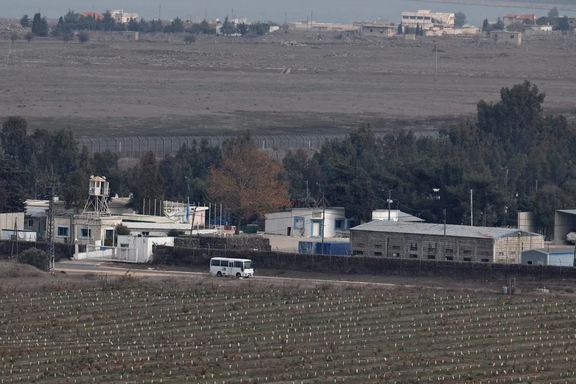 A UN bus at a base of the United Nations Disengagement Observer Force (UNDOF), near the Quneitra crossing, between Israel and Syria, as seen from the Israeli-annexed Golan Heights on Dec 7.