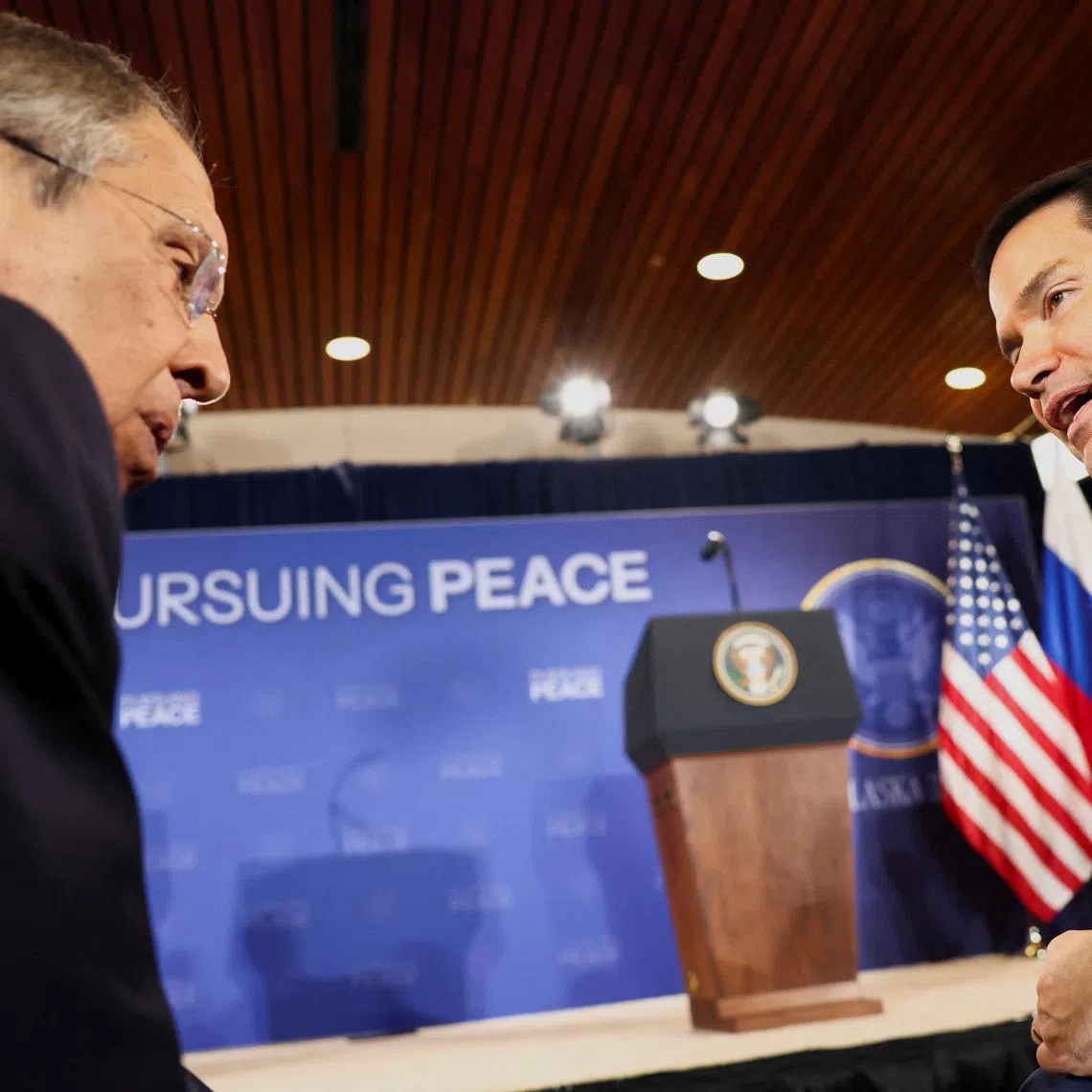 FILE PHOTO: Russian Foreign Minister Sergei Lavrov and U.S. Secretary of State Marco Rubio talk as they attend a press conference held by U.S. President Donald Trump and Russian President Vladimir Putin following their meeting to negotiate an end to the war in Ukraine, at Joint Base Elmendorf-Richardson, in Anchorage, Alaska, U.S., August 15, 2025. REUTERS/Kevin Lamarque/File Photo