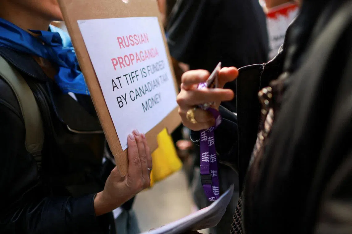 FILE PHOTO: Protesters gather outside the Toronto International Film Festival (TIFF) screening of 'Russians at War', a documentary about Russian troops fighting in Ukraine, in Toronto, Ontario, Canada September 10, 2024. REUTERS/Carlos Osorio/File Photo