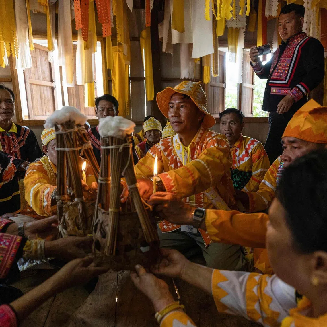 Lahu men taking part in a traditional religious cleansing ceremony in the village of Mae Haeng in Chiang Mai's Mae Ai district on Dec 10, 2025.