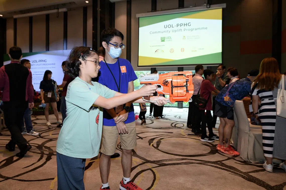 Children living in rental flats in Jurong West took part in game booths at the launch of the UOL-PPHG Community Uplift Programme on Jan 28, 2023.