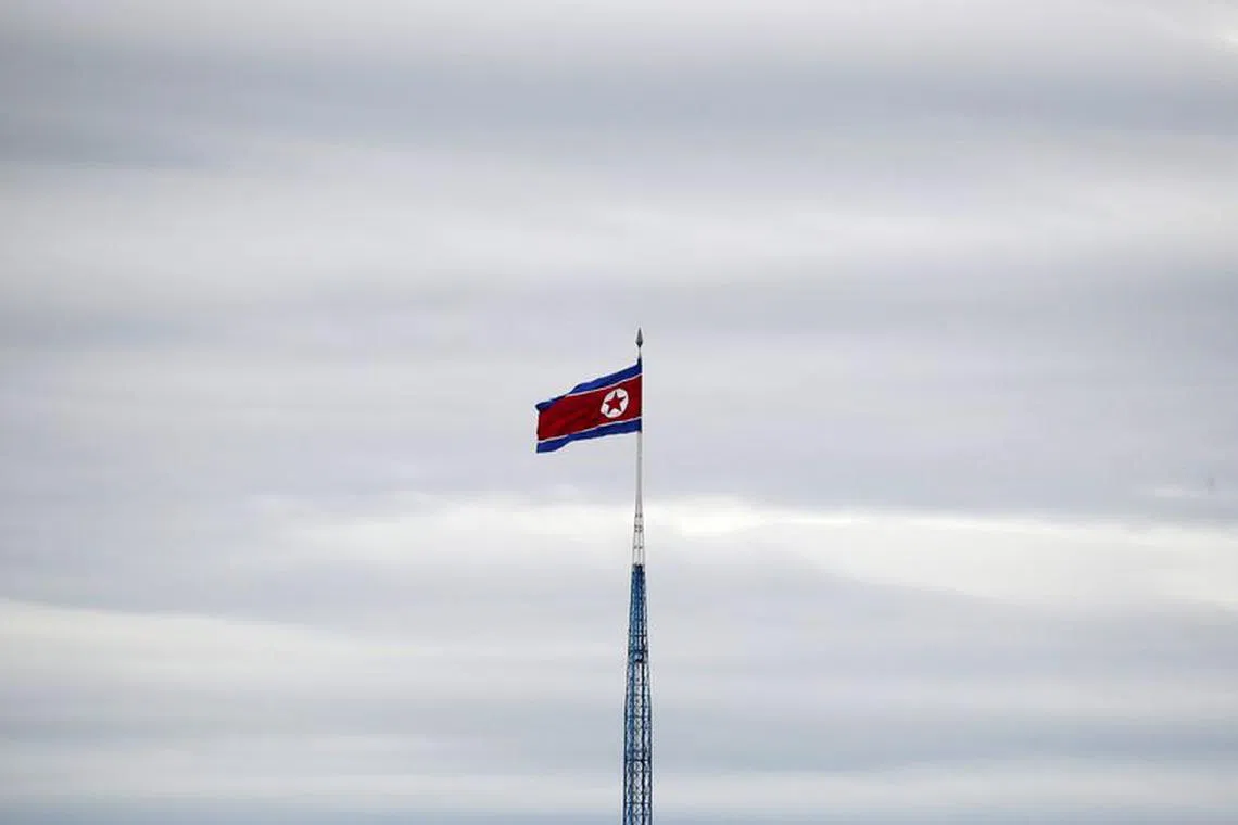 FILE PHOTO: A North Korean flag flutters on top of a 160-metre tower in North Korea's propaganda village of Gijungdong, in this picture taken from the Tae Sung freedom village near the Military Demarcation Line (MDL), inside the demilitarised zone separating the two Koreas, in Paju, South Korea, April 24, 2018. REUTERS/Kim Hong-Ji
