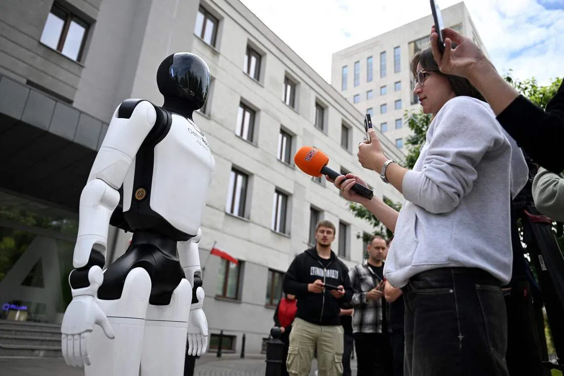 A humanoid robot of Delta Robots Agibot is seen during an interview with a journalist during a demonstration calling for the regulation of artificial intelligence development in Warsaw on September 7, 2026. Waving flags, "chanting" slogans, and marching in circles -- around thirty robots took to the streets to raise awareness for AI regulation in front of the digital affairs ministry on September 7, 2026. (Photo by Sergei GAPON / AFP)