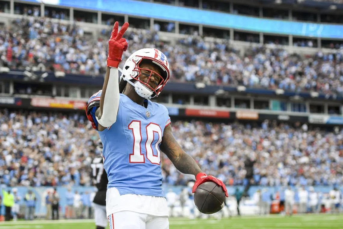 FILE PHOTO: Oct 29, 2023; Nashville, Tennessee, USA;  Tennessee Titans wide receiver DeAndre Hopkins (10) celebrates his third touchdown of the game against the Atlanta Falcons during the second half at Nissan Stadium. Mandatory Credit: Steve Roberts-USA TODAY Sports/File Photo
