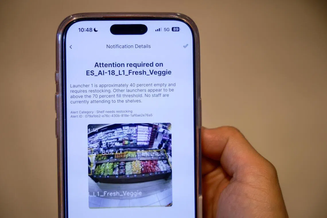 A store manager using the Grocer Genie app at Fairprice Finest at Punggol Coast on April 20.