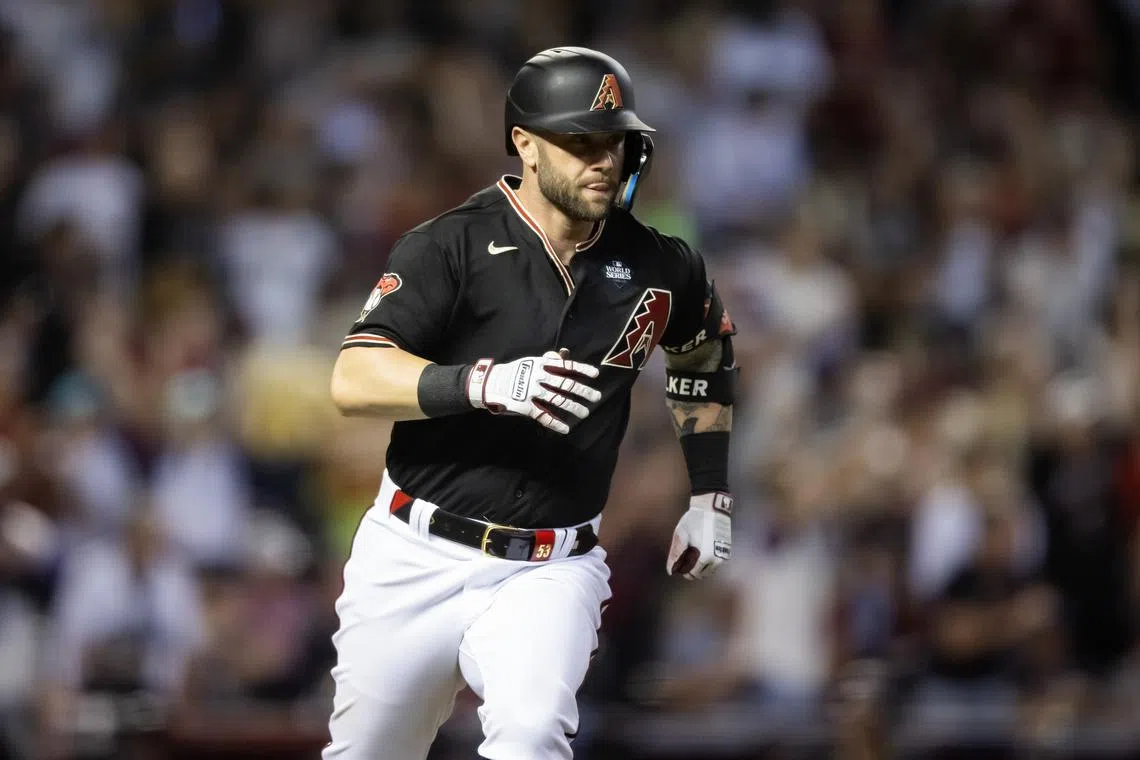 FILE PHOTO: Oct 31, 2023; Phoenix, Arizona, USA; Arizona Diamondbacks first baseman Christian Walker (53) hits a double against the Texas Rangers during the fourth inning in game four of the 2023 World Series at Chase Field. Mandatory Credit: Mark J. Rebilas-USA TODAY Sports/File photo