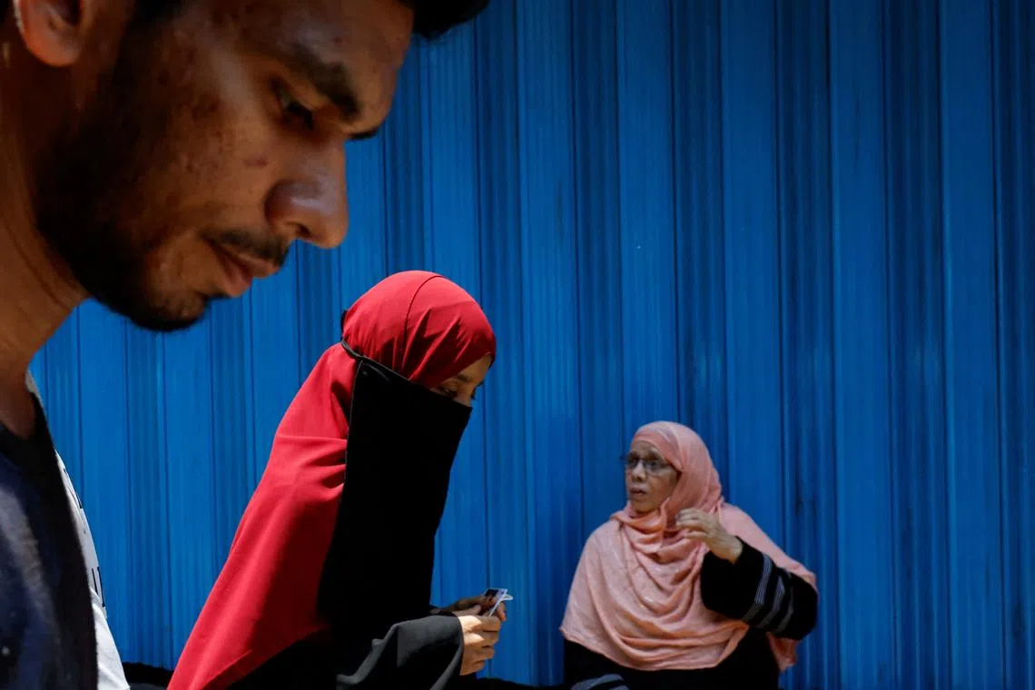 People leaving a polling station after voting, during the fifth phase of India's general election, in Mumbra, on the outskirts of Mumbai, India, May 20, 2024. 