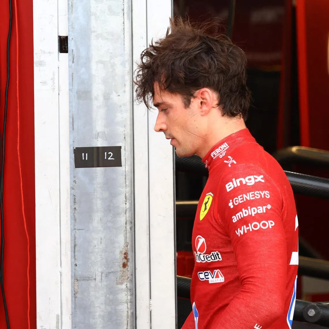 Formula One F1 - Monaco Grand Prix - Circuit de Monaco, Monaco - June 7, 2026 Ferrari's Charles Leclerc looks dejected as he walks back to the garage after crashing out of the race REUTERS/Yves Herman/Pool