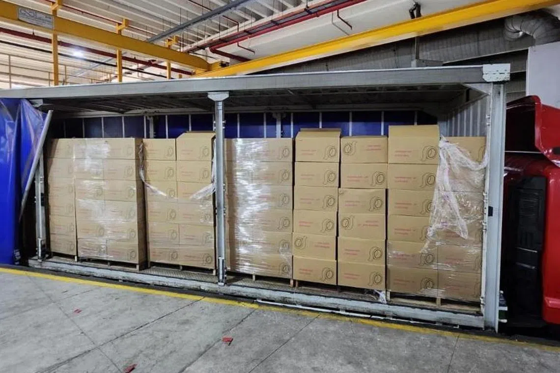 The cartons of contraband were hidden with cellophane tape in a Malaysia-registered lorry.