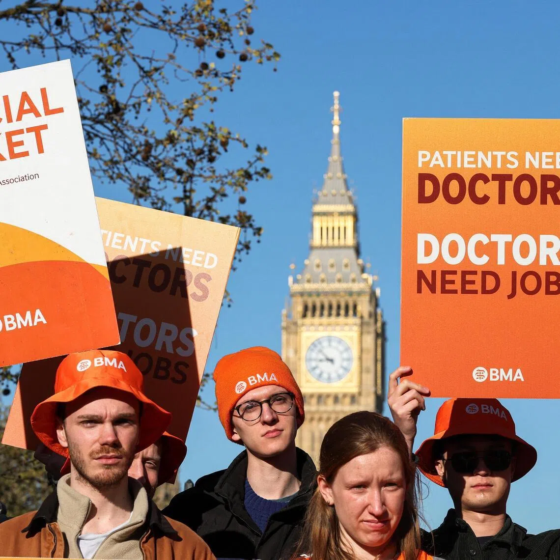 Resident doctors hold placards during a picket on the first day of a six-day industrial action amid a dispute over pay and staffing pressures in London in April 2026.