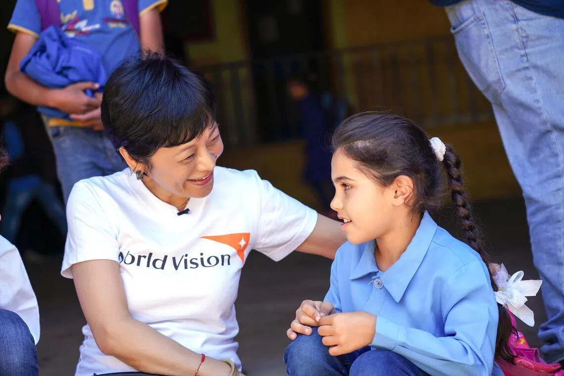 Sylvia Chang with a child during a field trip to Lebanon in 2019.