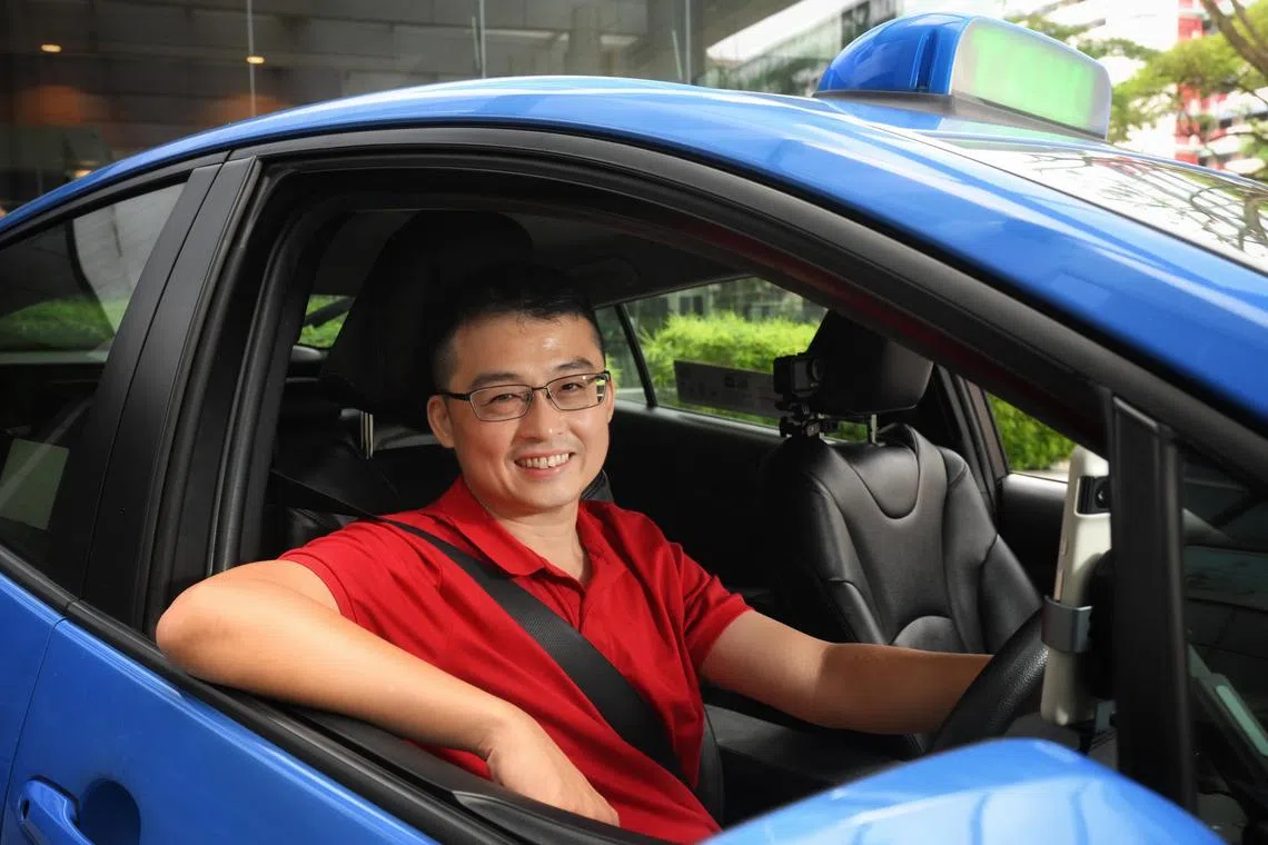 Vlogger and taxi driver Edward Jui (LazyCabbie) in his taxi on July 11, 2025.