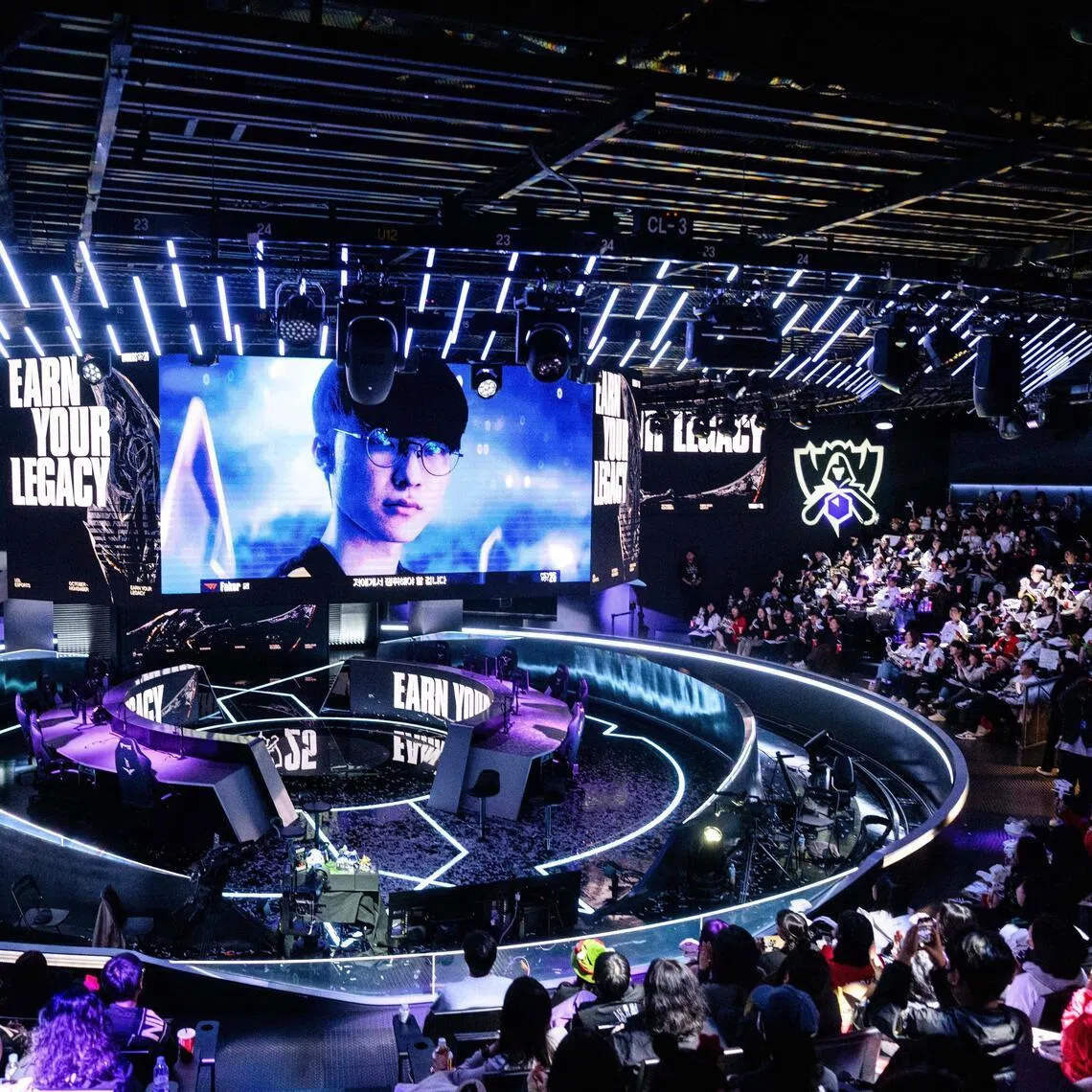 A photo of T1’s Faker is shown on a large monitor as South Korea’s T1 and KT fans attend a viewing party for the League of Legends 2025 World Championship Finals at LoL Park Stadium, an e-sports venue in Seoul on November 9, 2025, as the LoL Worlds Championship finals between T1 and KT takes place in Chengdu. (Photo by ANTHONY WALLACE / AFP)