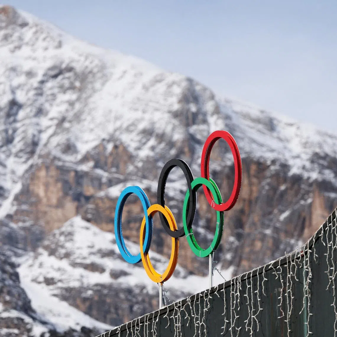 FILE PHOTO: A general view shows the Olympic rings on the Cortina Curling Olympic Stadium, which will host the curling, wheelchair curling, and Paralympic closing ceremony during the Milano Cortina Winter Olympic Games 2026, in Cortina, Italy, January 25, 2025. REUTERS/Claudia Greco/File Photo