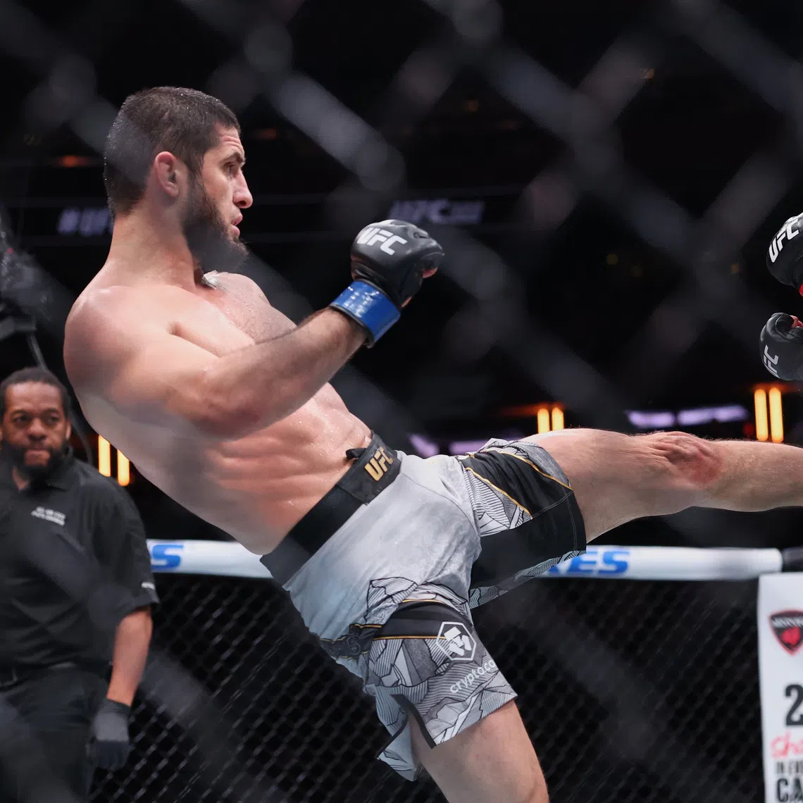 Islam Makhachev (left) fighting Jack Della Maddalena in the welterweight championship bout during UFC 322 on Nov 15.