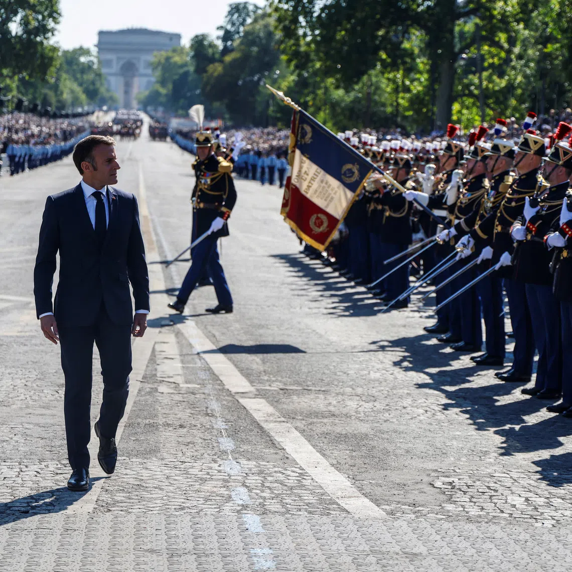 France's President Emmanuel Macron reviews the troops during the Bastille Day military parade on the Avenue Foch with the Arc de Triomphe in background, in Paris, France on July 14, 2024.  LUDOVIC MARIN/Pool via REUTERS/File Photo