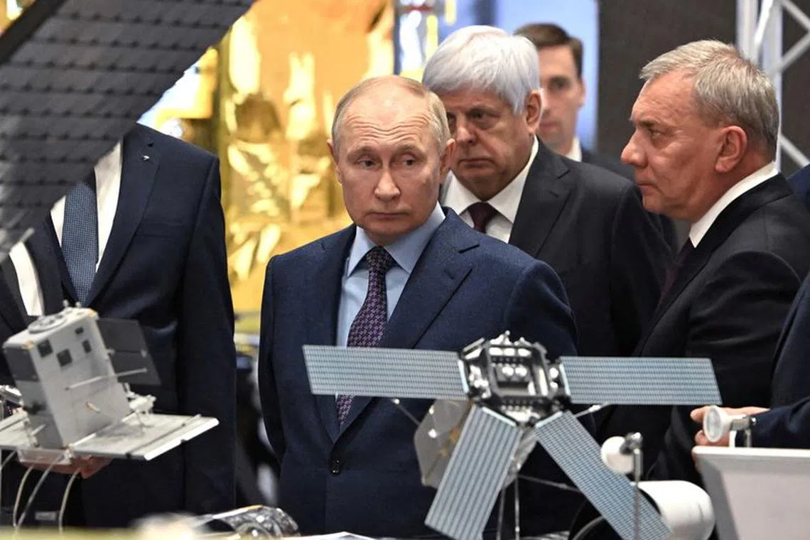 FILE PHOTO: Russia's President Vladimir Putin, accompanied by head of the Roscosmos space corporation Yuri Borisov, visits the centre of the Rocket and Space Corporation \"Energia\" in Korolyov outside Moscow, Russia, October 26, 2023. Sputnik/Sergei Bobylev/Pool via REUTERS/File Photo