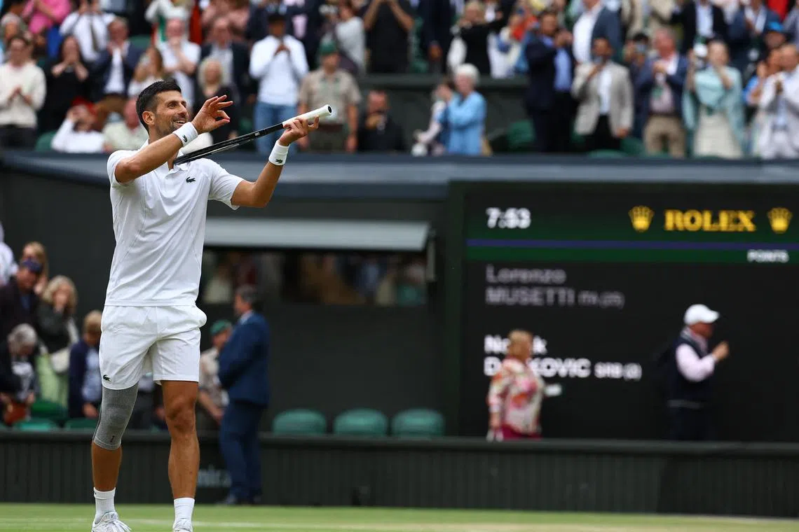 Serbia's Novak Djokovic celebrates after winning his semi final match against Italy's Lorenzo Musetti.