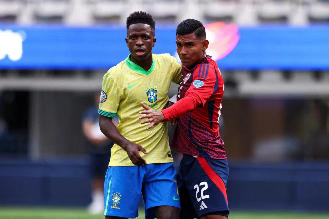 FILE PHOTO: Jun 24, 2024; Inglewood, CA, USA; Brazil forward Vinícius Júnior (7) and Costa Rica defender Haxzel Quiros Cruz (22) prepare for a corner kick during the first half of a match at SoFi Stadium. Mandatory Credit: Jessica Alcheh-USA TODAY Sports/File Photo