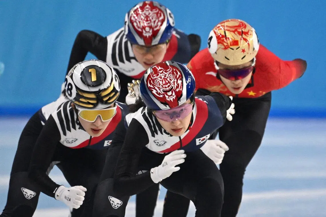 TOPSHOT - South Korea’s Choi Min-jeong (C) and South Korea’s Kim Gil-li (L) compete in the women’s 1000m final short track speed skating event during the Harbin 2025 Asian Winter Games in Harbin, northeast China’s Heilongjiang province on February 9, 2025. (Photo by Jade GAO / AFP)