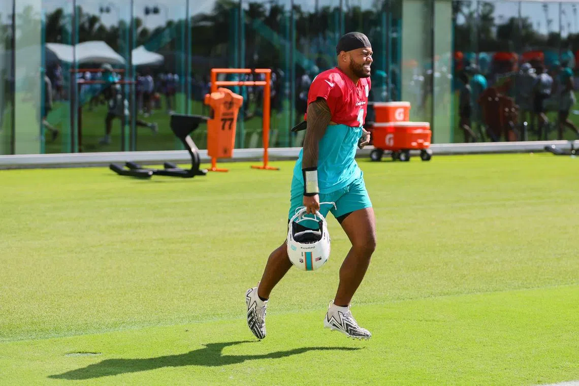 FILE PHOTO: Aug 15, 2024; Miami Gardens, FL, USA; Miami Dolphins quarterback Tua Tagovailoa (1) runs on the field during joint practice with the Washington Commanders at Baptist Health Training Complex. Mandatory Credit: Sam Navarro-USA TODAY Sports/File Photo