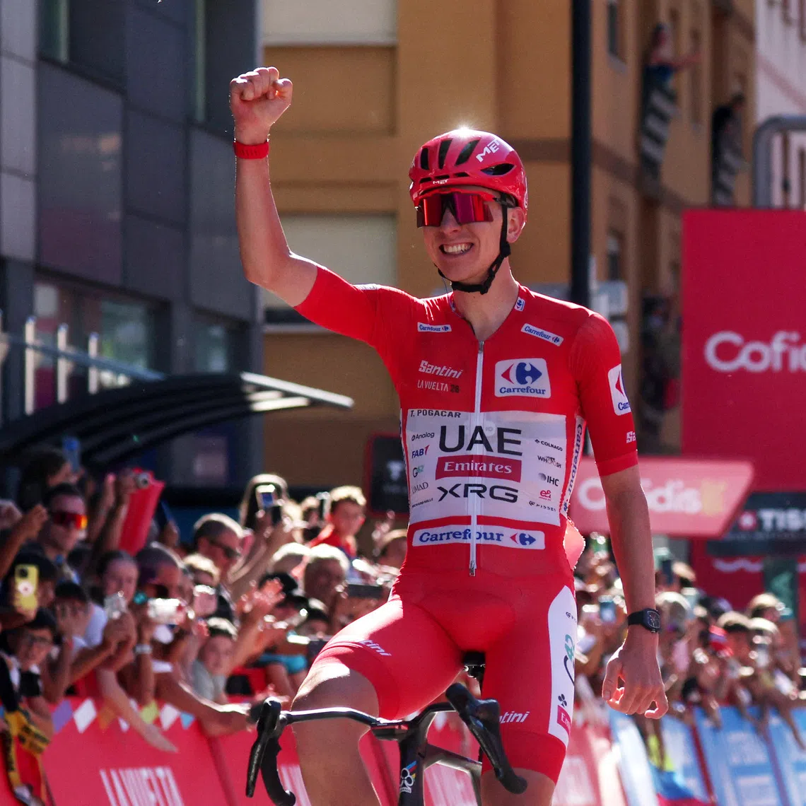 UAE Team Emirates-XRG’s Tadej Pogacar celebrates after winning Stage 4 of the Vuelta a Espana on Aug 25.