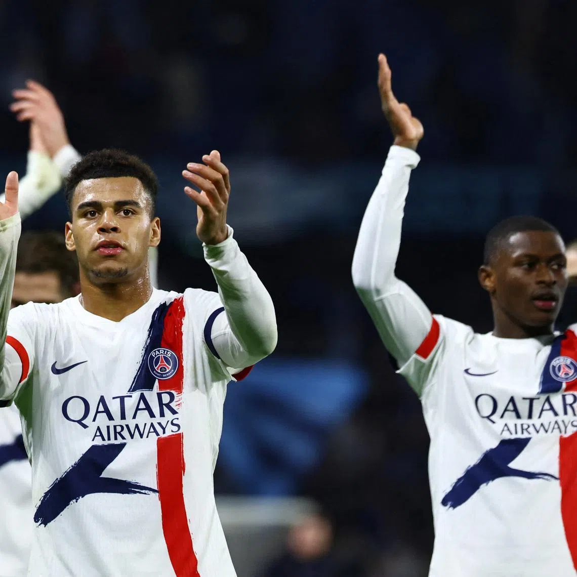 Soccer Football - Ligue 1 - Le Havre AC v Paris St Germain - Stade Oceane, Le Havre, France - February 28, 2026 Paris St Germain's Desire Doue applauds fans after the match with Nuno Mendes REUTERS/Sarah Meyssonnier