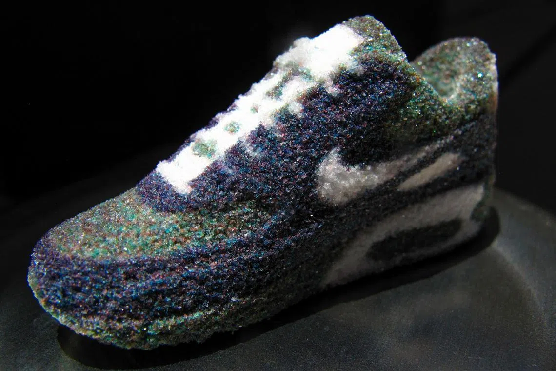 A Nike running shoe made of sugar was made by a 3D printer at Sugar Lab, a California company that is using its 3D printing technology to deliver 3D printed candy and chocolates in Los Angeles, California, U.S. on July 8, 2023. 

   