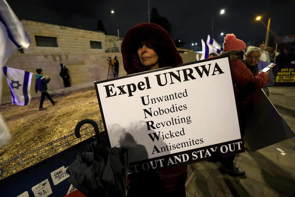 epa11129734 Israeli right-wing activists hold up banners during in a demonstration demanding the immediate removal of the UNRWA headquarters in Jerusalem, 05 February 2024. The United Nations Relief and Works Agency for Palestine Refugees (UNRWA), the primary aid agency for Palestinians in Gaza and the Middle East, is accused by Israel of having some of its workers involved in the 07 October Hamas attacks. Thousands of Israelis and Palestinians have been killed since the militant group Hamas launched an unprecedented attack on Israel from the Gaza Strip on 07 October 2023, and the Israeli strikes on the Palestinian enclave which followed it.  EPA-EFE/ATEF SAFADI