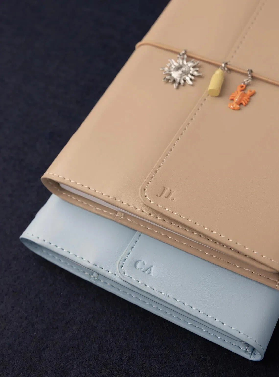 The Paper Bunny 2027 Planner Folios with custom monogramming and mini charm add-ons.
