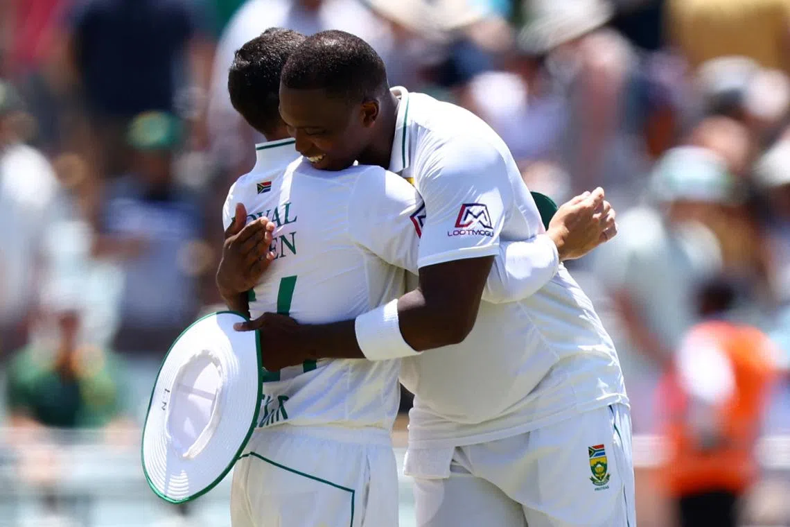FILE PHOTO: Cricket - Second Test - South Africa v India - Newlands Cricket Ground, Cape Town, South Africa - January 4, 2024 South Africa's Dean Elgar reacts with Lungi Ngidi after the match and retiring from international cricket REUTERS/Esa Alexander/File Photo