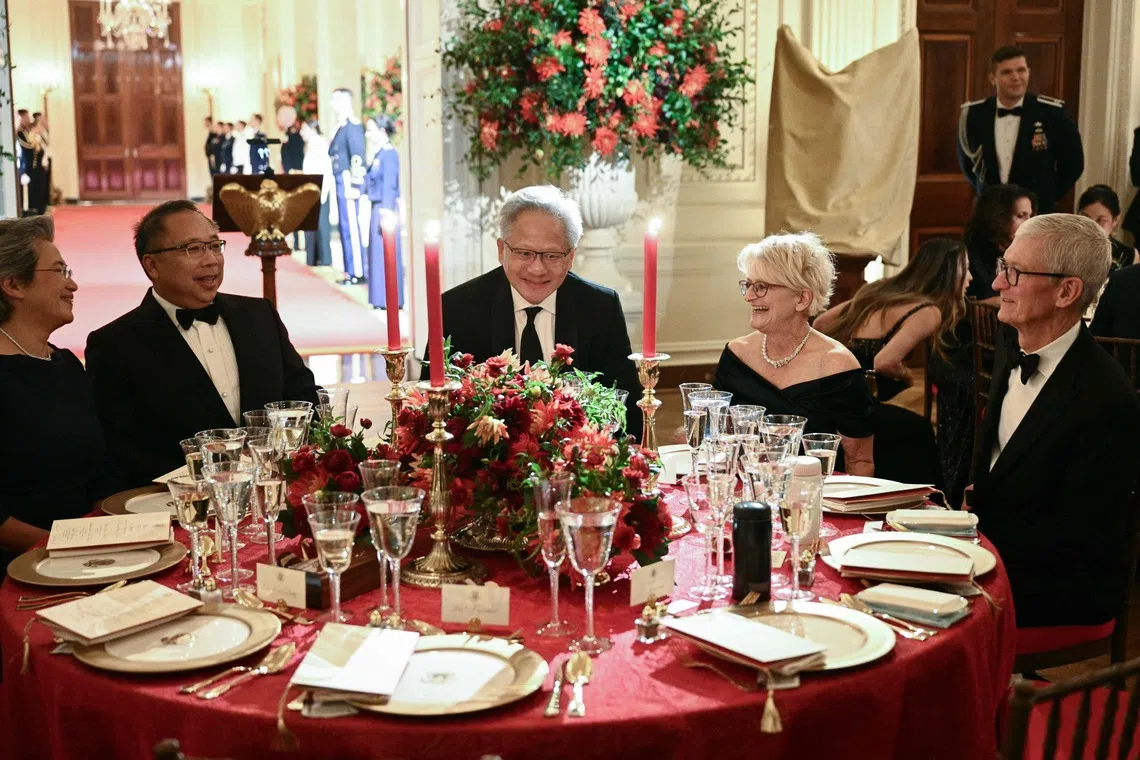 (From left) Advanced Micro Devices’ Lisa Su, her husband Daniel Lin, Nvidia CEO Jensen Huang, his wife Lori Huang and Apple executive chairman Tim Cook at a state dinner hosted by US President Donald Trump for Chinese President Xi Jinping at the White House on Sept 24.