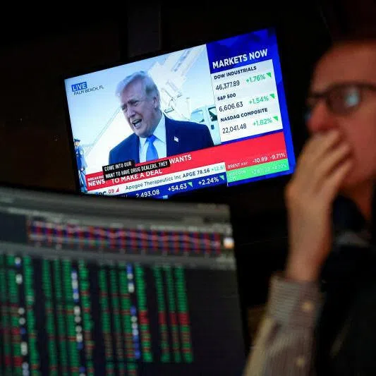 A trader works on the floor at the New York Stock Exchange in New York City, on March 23, 2026.