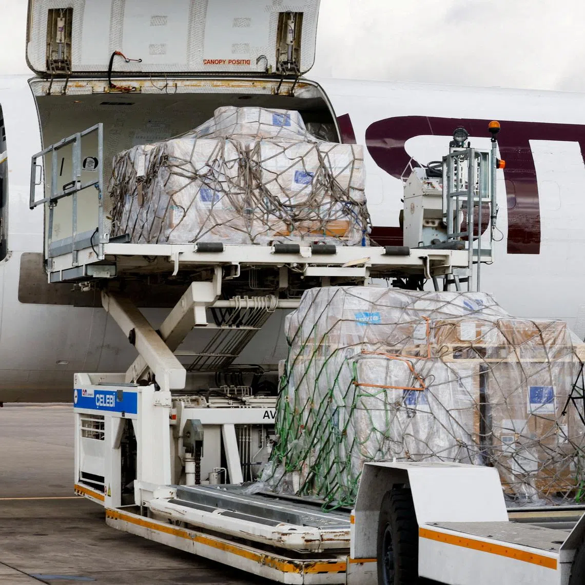 FILE PHOTO: A European Commission Civil Protection and Humanitarian Aid Operations (ECHO) crew member dressed in Personal Protective Equipment (PPE) stands as essential medical supplies and emergency kits are loaded on an aircraft to support the affected regions in Bunia, Ituri province, amidst the Ebola outbreak in the Democratic Republic of Congo, at the Jomo Kenyatta International Airport (JKIA) in Nairobi, Kenya, June 4, 2026. REUTERS/Monicah Mwangi/File Photo