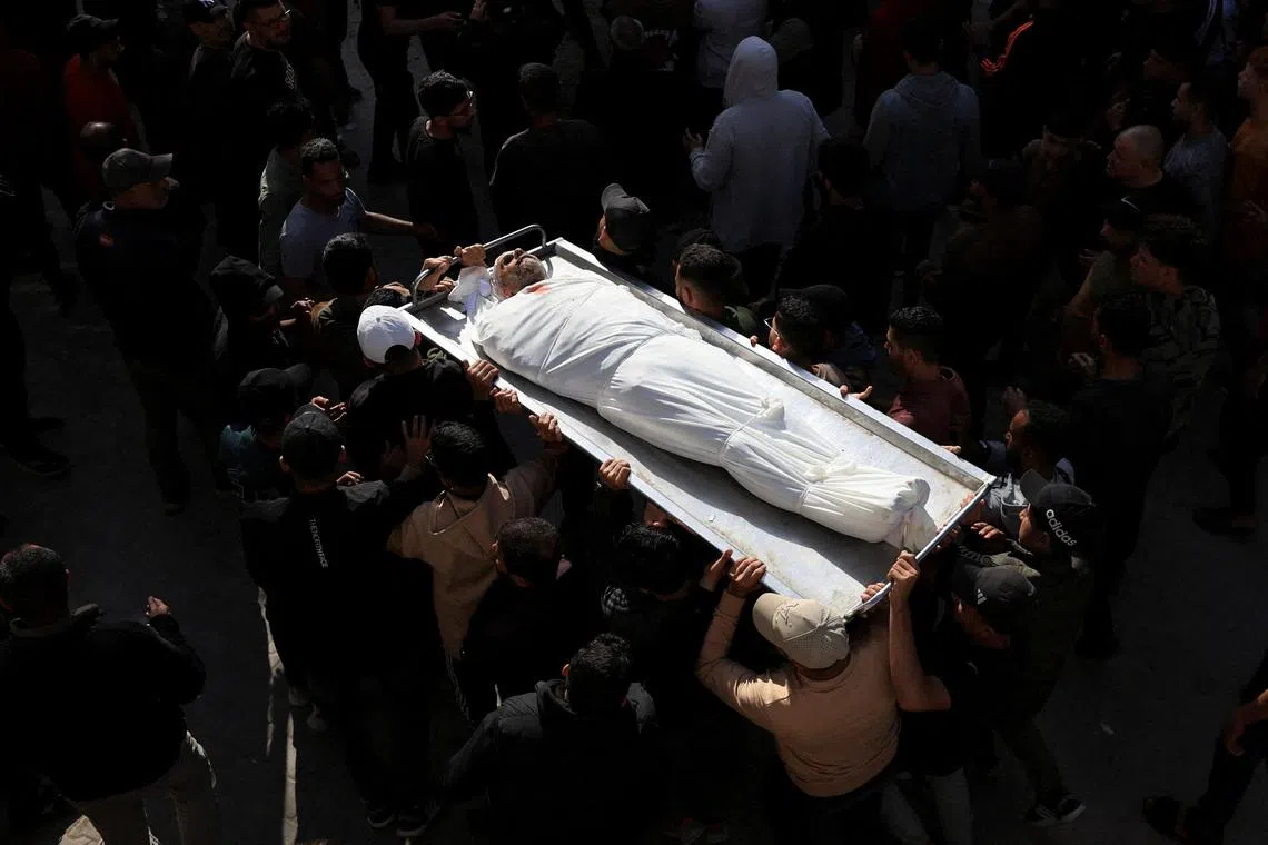 Mourners attending the funeral of Palestinians who were killed today in an Israeli strike, according to medics, at Al-Shifa Hospital in Gaza City, April 28, 2026. 