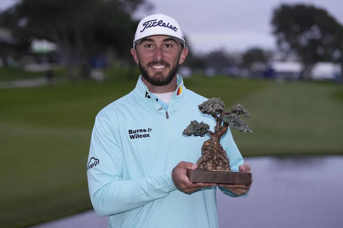 Max Homa posing with the championship trophy after the final round of the Farmers Insurance Open golf tournament at Torrey Pines on Saturday. 