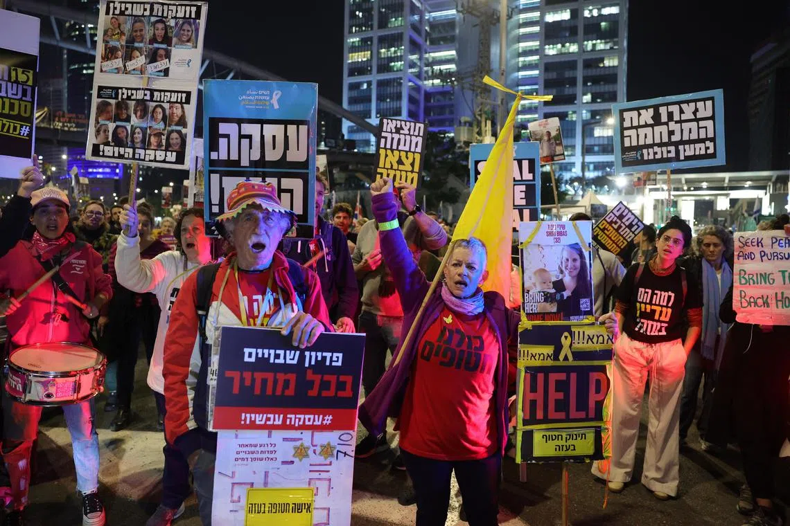 Family members and supporters of hostages held by Hamas in Gaza calling for a ceasefire and for the release of the hostages, outside the ruling Likud party headquarters in Tel Aviv, Israel, on Jan 15.