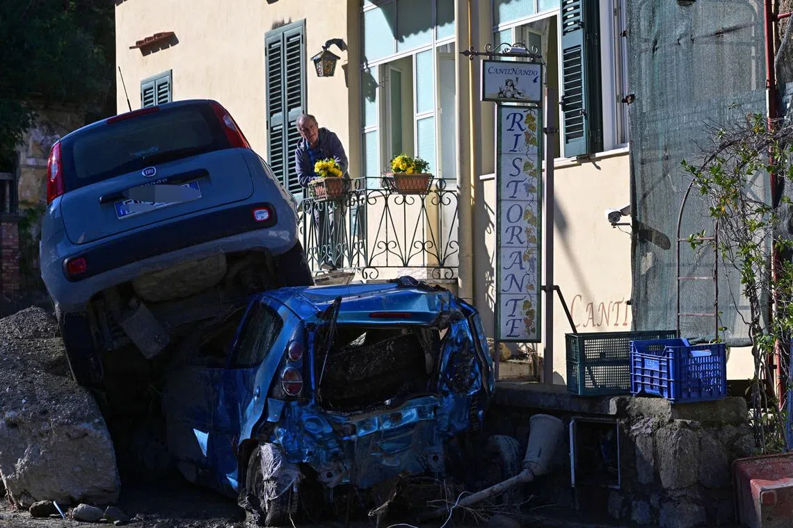 Damaged cars on the roads dragged by the mud in Casamicciola, Italy, Nov 27, 2022. Italy has declared state of emergency following the deadly landslide on Ischia Island.