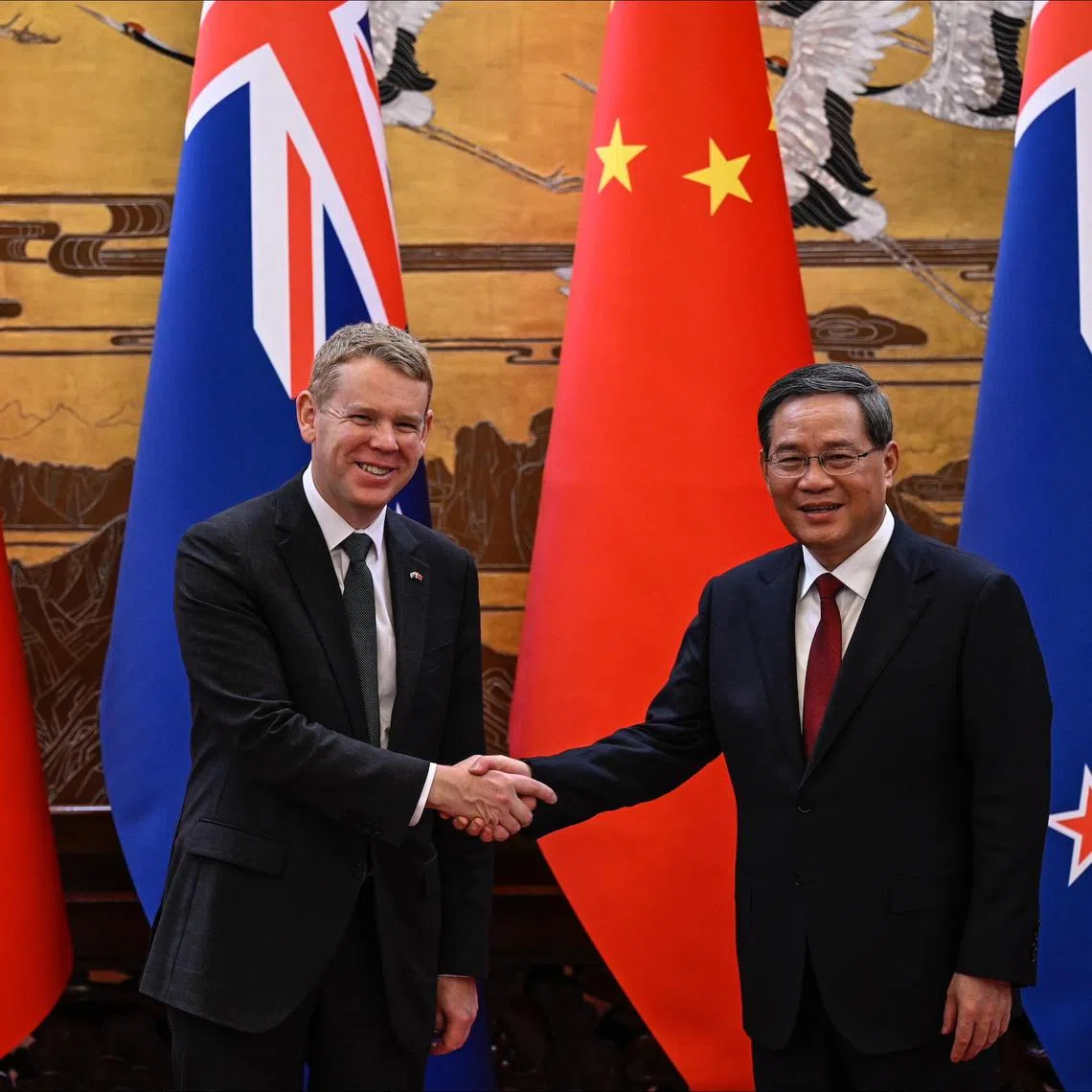 New Zealand PM Chris Hipkins (left) is in China to drum up business and help his nation exit an election-year recession.